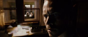 Movie still from “Running Scared” (2006), directed by Wayne Kramer – A man's face in front of a mirror; Extreme Close Up shot, Over the shoulder angle
