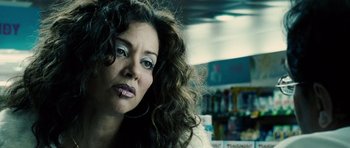 Movie still from “Running Scared” (2006), directed by Wayne Kramer – A person with long curly hair; Close Up shot, Low angle