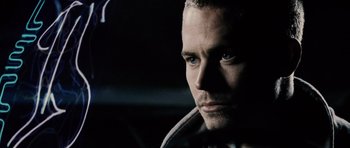 Movie still from “Running Scared” (2006), directed by Wayne Kramer – A person in a car looking at the camera; Close Up shot, Over the shoulder angle