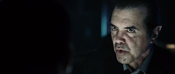 Movie still from “Running Scared” (2006), directed by Wayne Kramer – A person looking at the camera; Close Up shot, Over the shoulder angle