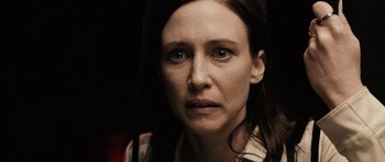 Movie still from “Running Scared” (2006), directed by Wayne Kramer – A person wearing a white shirt; Close Up shot, Over the shoulder angle