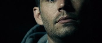 Movie still from “Running Scared” (2006), directed by Wayne Kramer – View of a man's face; Extreme Close Up shot, Over the shoulder angle