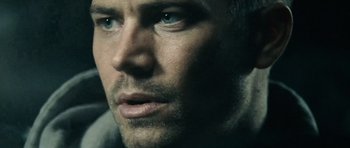 Movie still from “Running Scared” (2006), directed by Wayne Kramer – A man's face with blue eyes; Extreme Close Up shot, Over the shoulder angle