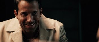 Movie still from “Running Scared” (2006), directed by Wayne Kramer – A person wearing a jacket; Close Up shot, Over the shoulder angle