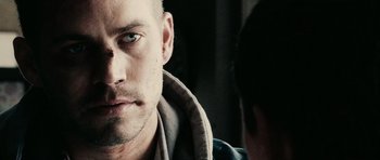 Movie still from “Running Scared” (2006), directed by Wayne Kramer – A person with a beard looking at a mirror; Close Up shot, Over the shoulder angle