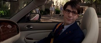 Movie still from “Rushmore” (1998), directed by Wes Anderson – A man sitting in the driver's seat of a car; Close Up shot, Over the shoulder angle