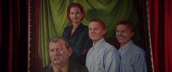 Movie still from “Rushmore” (1998), directed by Wes Anderson – An oil painting of a family of four; Medium shot, High angle