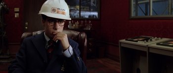 Movie still from “Rushmore” (1998), directed by Wes Anderson – A man wearing a white hard hat and glasses; Close Up shot, Over the shoulder angle