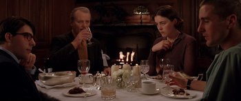 Movie still from “Rushmore” (1998), directed by Wes Anderson – A man and a woman sitting at a dinner table; Medium shot, Over the shoulder angle