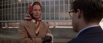 Movie still from “Rushmore” (1998), directed by Wes Anderson – A woman wearing a head scarf sitting next to a man; Close Up shot, Over the shoulder angle