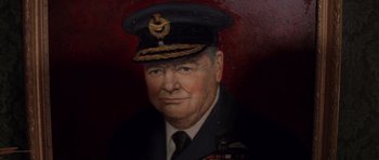 Movie still from “Rushmore” (1998), directed by Wes Anderson – An older man wearing a military uniform and a hat; Close Up shot, Low angle