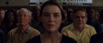 Movie still from “Rushmore” (1998), directed by Wes Anderson – A person with a crowd of people; Close Up shot, Low angle