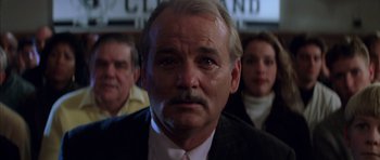 Movie still from “Rushmore” (1998), directed by Wes Anderson – A person wearing a suit and tie; Close Up shot, Low angle