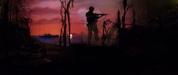 Movie still from “Rushmore” (1998), directed by Wes Anderson – Silhouette of a man holding a rifle in a field; Wide shot, Low angle