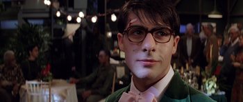 Movie still from “Rushmore” (1998), directed by Wes Anderson – A man in a green jacket wearing glasses; Close Up shot, Low angle