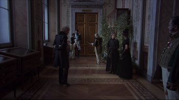 Movie still from “Russian Ark” (2002), directed by Aleksandr Sokurov – A group of people standing in a room; Wide shot, Over the shoulder angle
