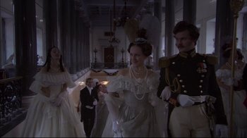 Movie still from “Russian Ark” (2002), directed by Aleksandr Sokurov – A group of people dressed in formal attire; Wide shot, Low angle