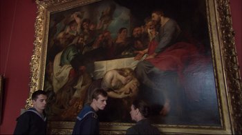 Movie still from “Russian Ark” (2002), directed by Aleksandr Sokurov – Two people standing in front of a large painting; Medium shot, High angle