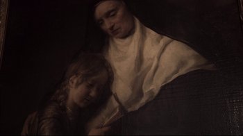 Movie still from “Russian Ark” (2002), directed by Aleksandr Sokurov – An older woman and a young girl in a dark room; Extreme Close Up shot, High angle