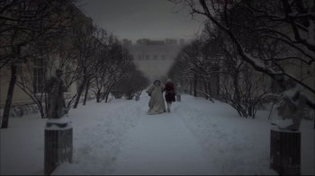 Movie still from “Russian Ark” (2002), directed by Aleksandr Sokurov – Two people are walking in the snow on a hill; Extreme Wide shot, Low angle