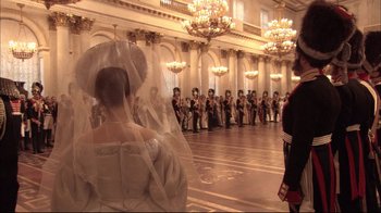 Movie still from “Russian Ark” (2002), directed by Aleksandr Sokurov – A group of people standing in front of a large room; Wide shot, Low angle