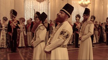 Movie still from “Russian Ark” (2002), directed by Aleksandr Sokurov – A group of men standing next to each other in a room; Medium shot, Low angle