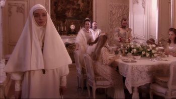 Movie still from “Russian Ark” (2002), directed by Aleksandr Sokurov – A group of people sitting at a table with food; Wide shot, Over the shoulder angle
