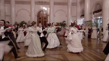Movie still from “Russian Ark” (2002), directed by Aleksandr Sokurov – A group of people dressed up in victorian clothing; Wide shot, Low angle