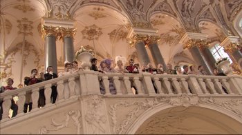 Movie still from “Russian Ark” (2002), directed by Aleksandr Sokurov – A group of people standing on top of a balcony; Extreme Wide shot, Low angle