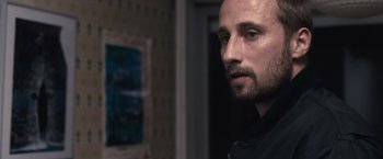 Movie still from “Rust and Bone” (2012), directed by Jacques Audiard – A person looking at the camera; Close Up shot, Over the shoulder angle