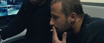 Movie still from “Rust and Bone” (2012), directed by Jacques Audiard – A person with a cigarette in his mouth; Close Up shot, Over the shoulder angle