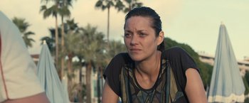Movie still from “Rust and Bone” (2012), directed by Jacques Audiard – A person sitting on a bench; Close Up shot, Over the shoulder angle