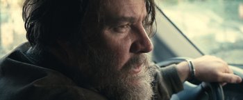 Movie still from “Rust and Bone” (2012), directed by Jacques Audiard – A person with a beard; Close Up shot, Over the shoulder angle