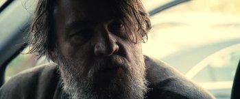 Movie still from “Rust and Bone” (2012), directed by Jacques Audiard – A person with a beard; Close Up shot, Over the shoulder angle