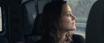 Movie still from “Rust and Bone” (2012), directed by Jacques Audiard – A person with long brown hair; Close Up shot, Low angle