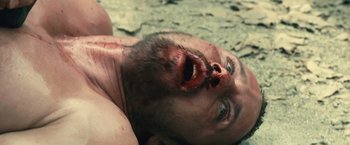 Movie still from “Rust and Bone” (2012), directed by Jacques Audiard – A person with a beard and a beard on; Close Up shot, Overhead angle