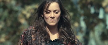 Movie still from “Rust and Bone” (2012), directed by Jacques Audiard – A person with long brown hair; Close Up shot, Low angle