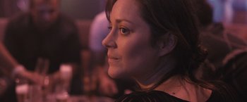 Movie still from “Rust and Bone” (2012), directed by Jacques Audiard – A person looking to her left; Close Up shot, Over the shoulder angle