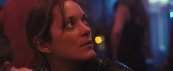 Movie still from “Rust and Bone” (2012), directed by Jacques Audiard – A person wearing a leather jacket; Close Up shot, Low angle