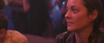 Movie still from “Rust and Bone” (2012), directed by Jacques Audiard – A person wearing a leather jacket; Close Up shot, Over the shoulder angle