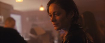 Movie still from “Rust and Bone” (2012), directed by Jacques Audiard – A person looking at the camera; Close Up shot, Over the shoulder angle