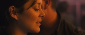 Movie still from “Rust and Bone” (2012), directed by Jacques Audiard – A woman's face and a man's face; Close Up shot, Over the shoulder angle