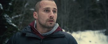 Movie still from “Rust and Bone” (2012), directed by Jacques Audiard – A person wearing a jacket; Close Up shot, Over the shoulder angle