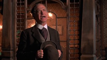 Movie still from “Rustlers' Rhapsody” (1985), directed by Hugh Wilson – An older man wearing a suit and a hat; Close Up shot, Low angle