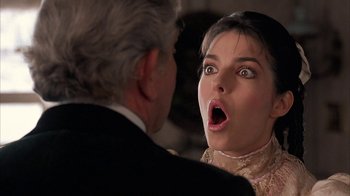 Movie still from “Rustlers' Rhapsody” (1985), directed by Hugh Wilson – A man and a woman looking at each other with a surprised look on their face; Close Up shot, Over the shoulder angle