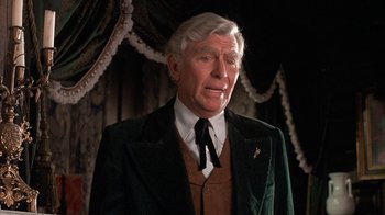 Movie still from “Rustlers' Rhapsody” (1985), directed by Hugh Wilson – An older man wearing a suit and tie; Close Up shot, Low angle