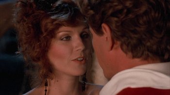 Movie still from “Rustlers' Rhapsody” (1985), directed by Hugh Wilson – A person looking at a person; Close Up shot, Over the shoulder angle