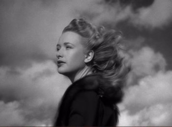 Movie still from “Saboteur” (1942), directed by Alfred Hitchcock – A black and white photo of a woman with long blonde hair; Close Up shot, Low angle