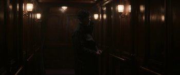 Movie still from “1899” (2022), created by Jantje Friese – A man standing in front of a door way; Medium shot, Low angle