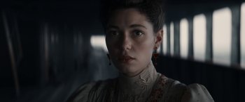 Movie still from “1899” (2022), created by Jantje Friese – A person wearing a dress; Close Up shot, Low angle